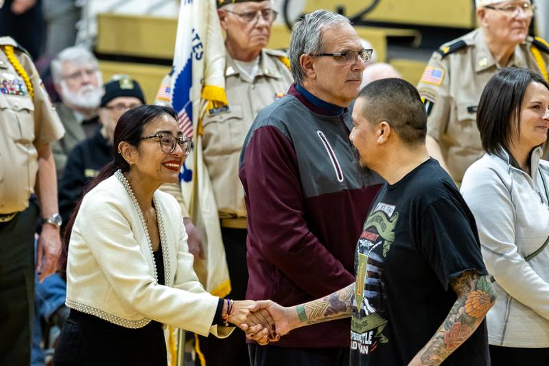 Dagmara “Dee” Avelar, Illinois 85th District State Representative shakes hands with a veteran during Lockport Township High School’s 11th Annual Veteran Night Celebration Ceremony on Jan. 23, 2026.