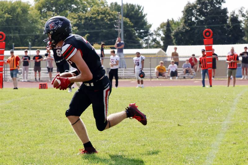 Erie-Prophetstown senior Connor Keegan runs the ball upfield Saturday, August 30, 2025,  after snatching an interception from the visiting Boilermakers on Saturday in Prophetstown. This was the second interception of the game for the Panthers who defeated the Boilermakers 29-6