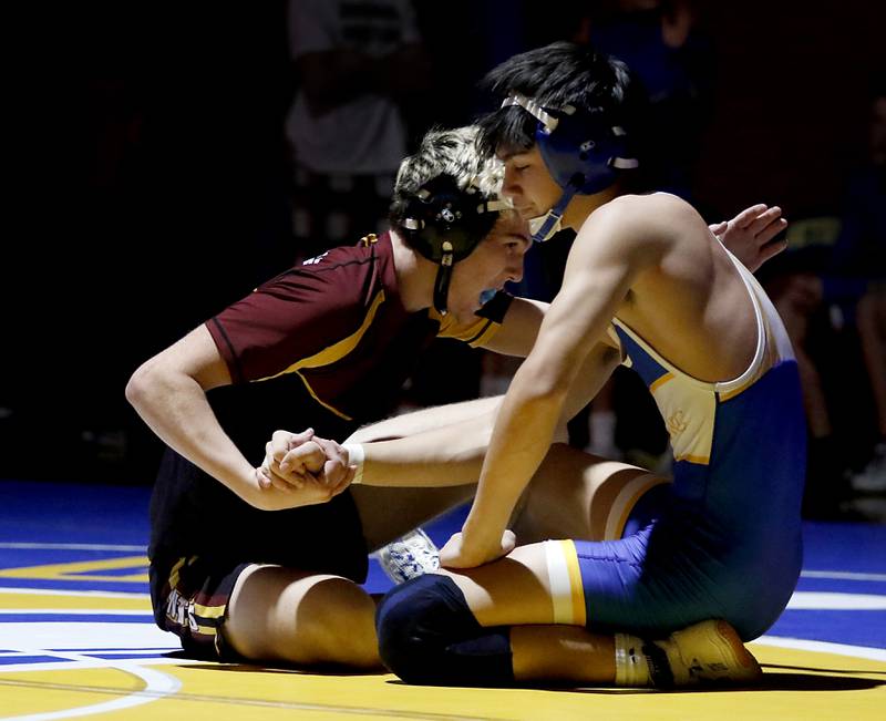 Richmond-Burton’s Dalton Youngs console  Johnsburg’s Kainoa Ancogi after Youngs defeated Ancogi in the 150-pound match of a Kishwaukee River Conference wrestling meet on Thursday, Jan. 30, 2025, at Johnsburg High School.