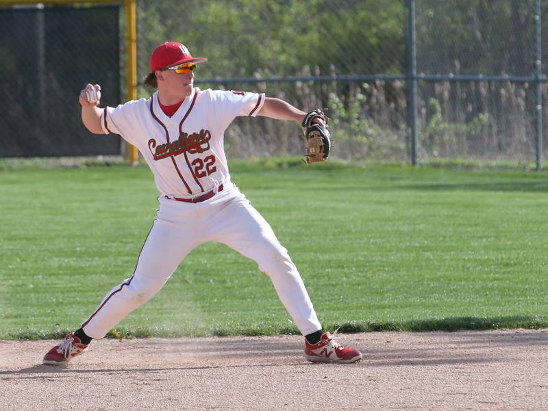 L-P's second baseman Kaeden Bond throws to first to force out a Morris runner on Friday, April 21, 2023 at Dickinson Field in Oglesby.