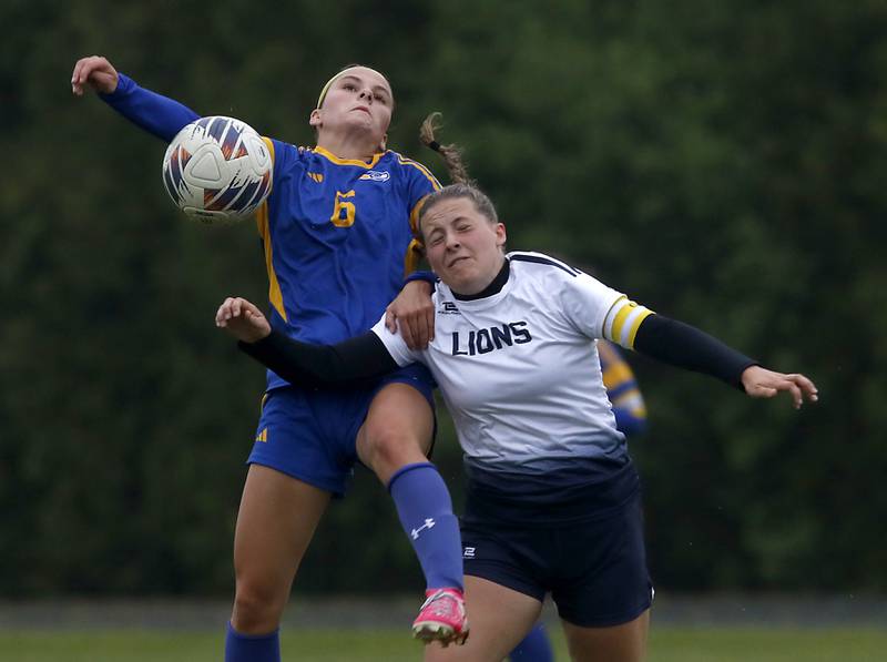 Johnsburg's Liz Smith battles with Harvest Christian Academy's Hanne Giovenco for the ball during the Class 1A Marian Central Girls Soccer Regional Championship match on Tuesday, May 20, 2025, at Marian Central High School in Woodstock.