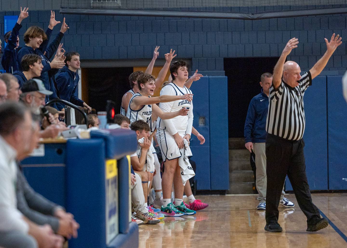 Fieldcrest’s bench celebrates team scoring 3-pointer on Monday, December 15, 2025 at Fieldcrest High School in Minonk.