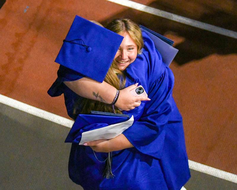 St. Charles North graduates hug as the ceremony concludes  on Monday, May 18, 2026  held at the NIU Convocation Center in DeKalb.