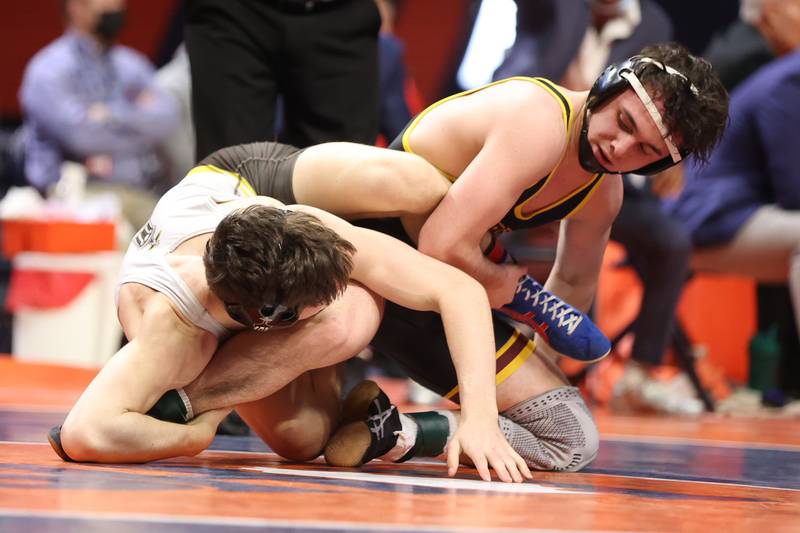 Montini’s Jayden Colon attempts to roll Joliet Catholic’s Mason Alessio in the Class 3A 145lb. championship match at State Farm Center in Champaign. Saturday, Feb. 19, 2022, in Champaign.