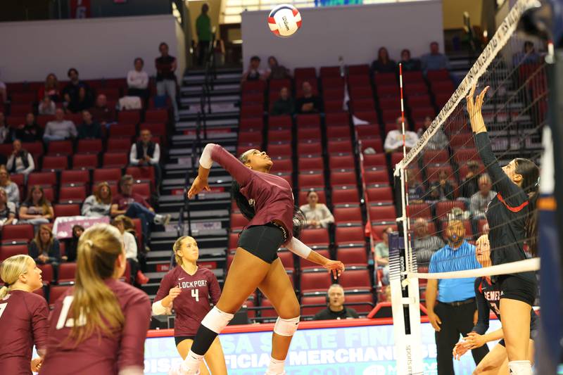 Lockport's Malia Cole prepares to spike against Benet Academy during Benet Academy's victory in two sets, 25-23, 25-16, over Lockport in the IHSA Class 4A State semifinals on Friday, Nov. 14, 2025.