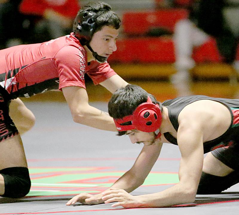 Ottawa's Ivan Munoz wrestles L-P's Sylvester St. Peter in the 106 weight match during a wrestling meet in Sellett Gymnasium on Wednesday Dec. 7, 2022 at L-P High School.