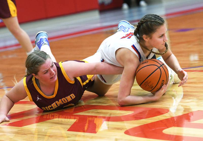 Oregon's Hadley Lutz battles Richmond Burton's Lyndsay Reigner for a loose ball at the Oregon Tip Off Tournament on Wednesday. Nov. 26.