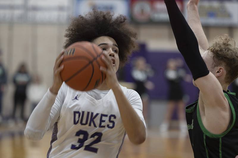 Dixon’s Darius Harrington works below the basket against Rock Falls Tuesday, Feb. 7, 2023.