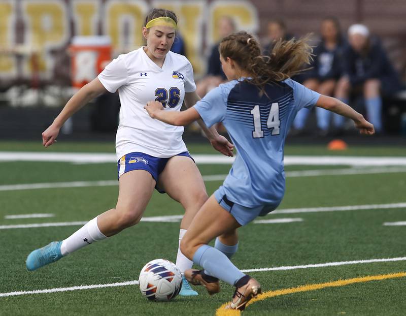 Johnsburg's Elaina Moss tries to take a shot at goal as she is defended by Willows’ Julia Lechner during a IHSA Division 1 Richmond-Burton Sectional semifinal soccer match Tuesday, May 16, 2023, at Richmond-Burton High School.