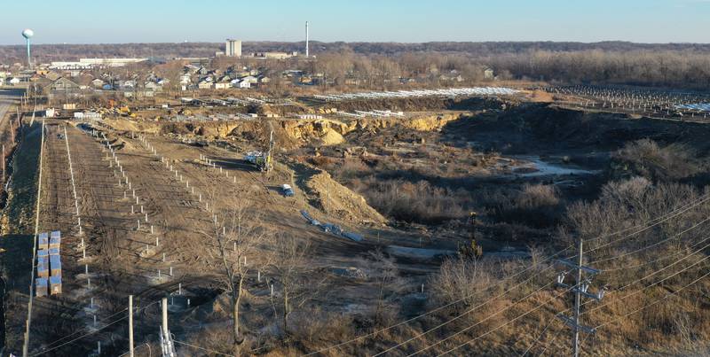 Crews prepare to erect a glass panel on the solar farm located in the 1400 block of North 27th Road (Dee Bennett Road) on Wednesday, Jan. 8, 2026 in Naplate.