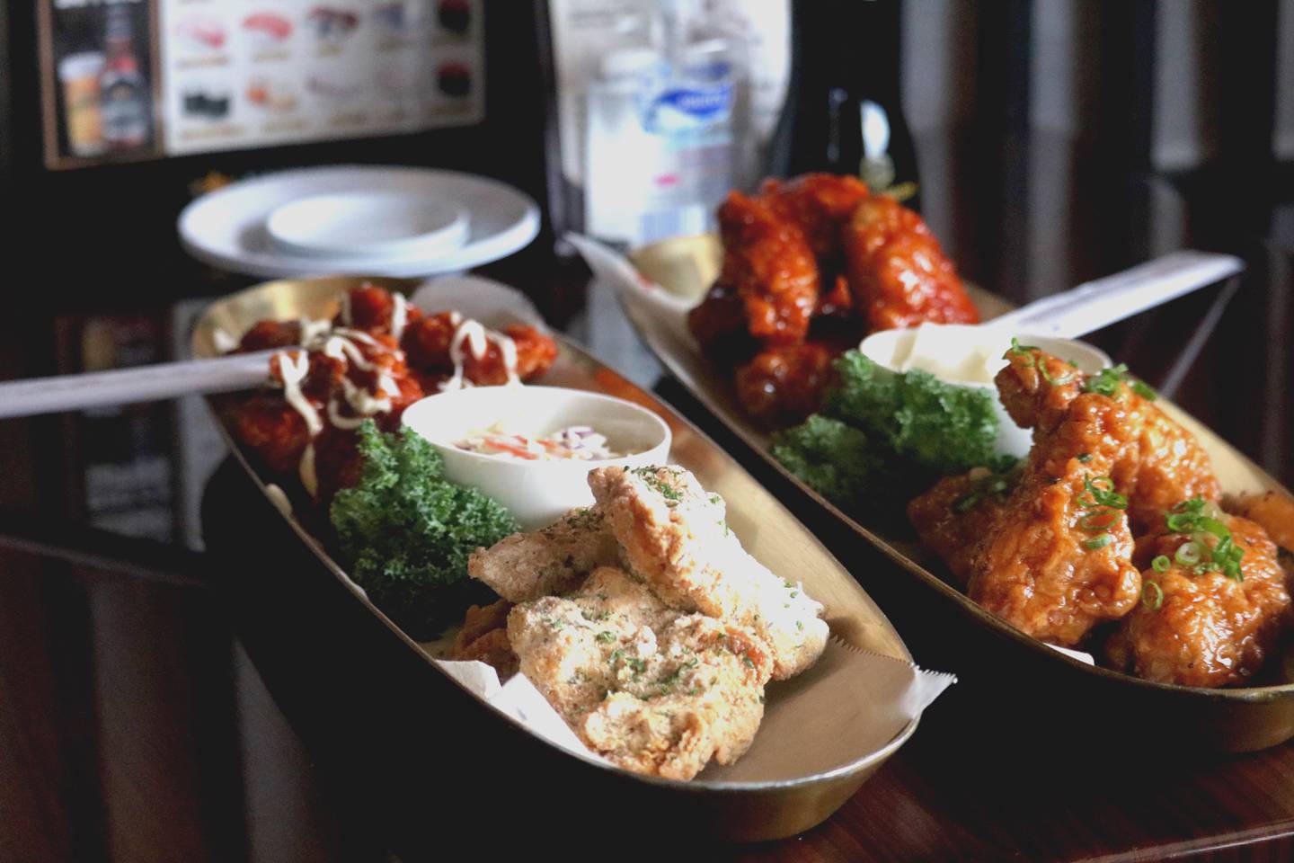 Korean fried chicken from Omi Sushi in DeKalb comes in a variety of flavors, including plain, magic sprinkle, soy garlic, sweet and mild, and supreme or hot. Omi Sushi in DeKalb is pictured March 13, 2023.