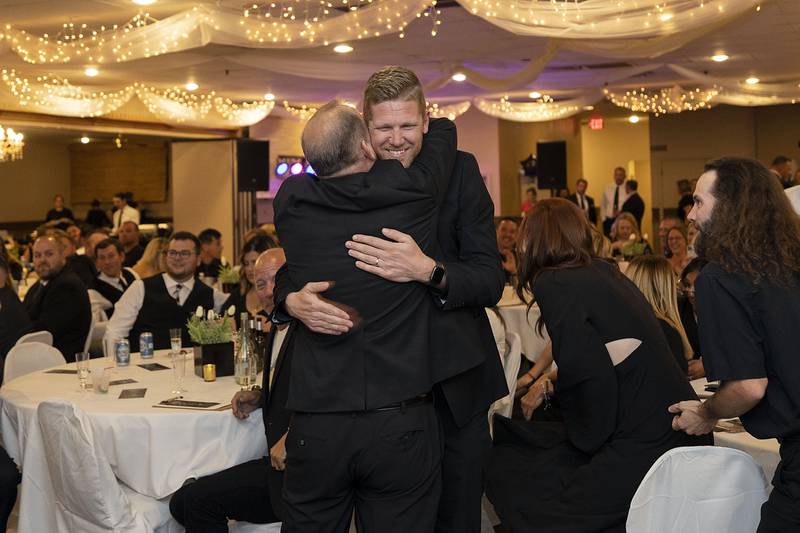 Dixon Park District recreation director Seth Nicklaus is hugged by DPD director Duane Long after Nicklaus was named one of Four Under 40 at the Best of Dixon awards Friday, May 5, 2023.