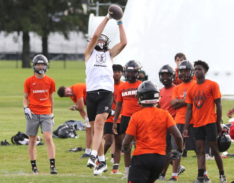 Kaneland and DeKalb players compete during 7-on-7 drills Tuesday, July 26, 2022, at Kaneland High School in Maple Park.