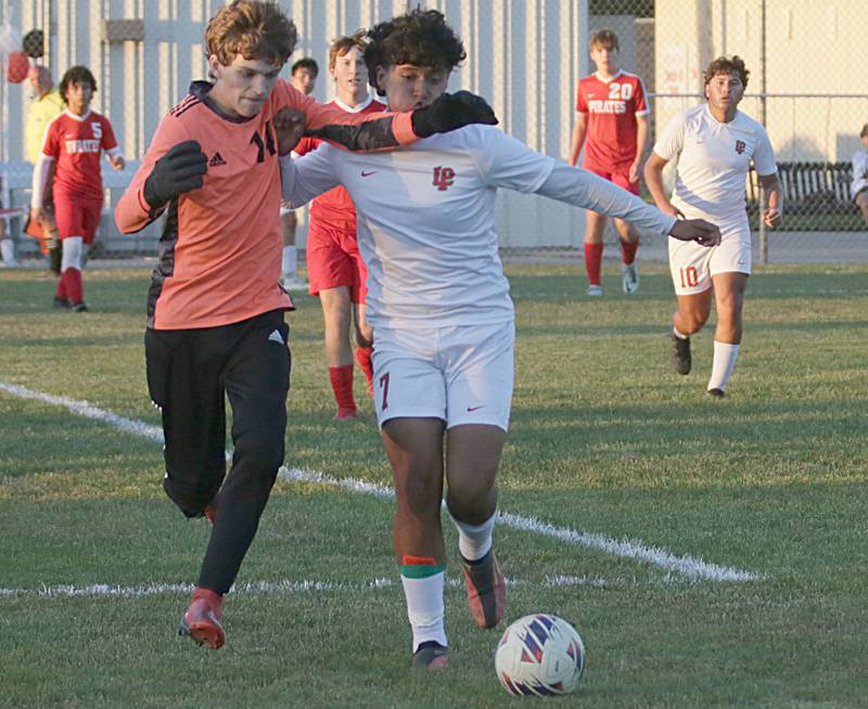 Ottawa's keeper Brady Wendt (14) holds back L-P's Braydan Gonzalez (7) on Monday, Oct. 3, 2022 in Ottawa.