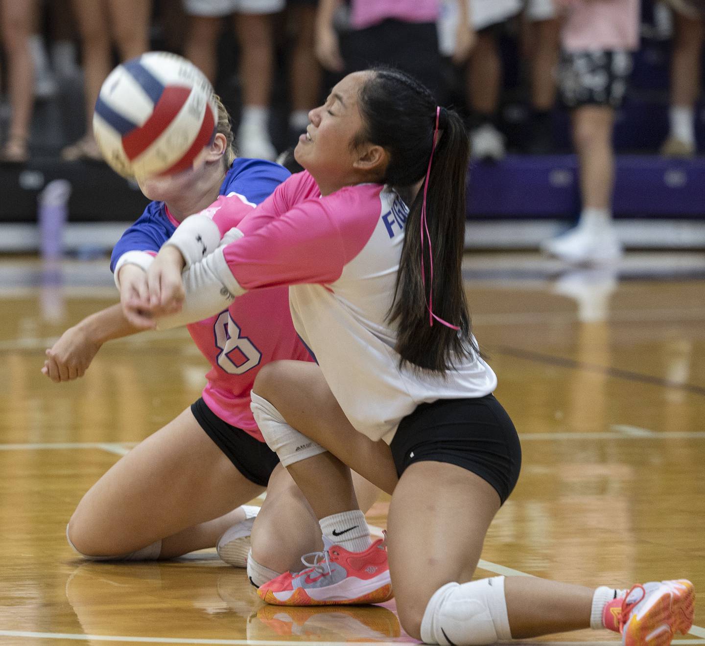 Dixon’s Micki Worrell (left) and Yui Santos go after a ball against Newman Thursday, Oct. 2, 2025.