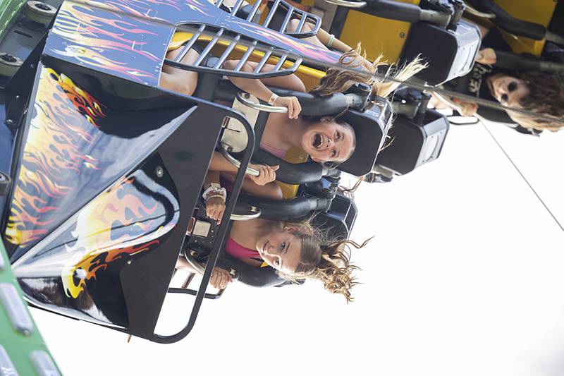 Riders go upside down on the Fireball Wednesday, July 3, 2024 on the opening day of the Petunia Fest carnival. The carnival will open Thursday at 1 and run until 11.