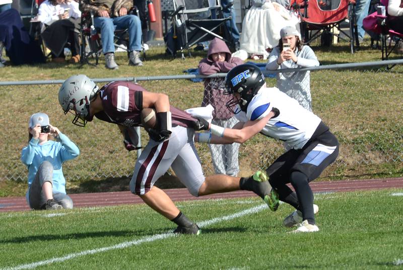 Rockridge's Treveor Dye (1) heads for the end zone after catching.a pass as Eastland-Pearl City's Sawyer Williams (2) tries to stop him in the 2A state football playoff's first round on Saturday, Nov. 2, 2024 at Eddington.