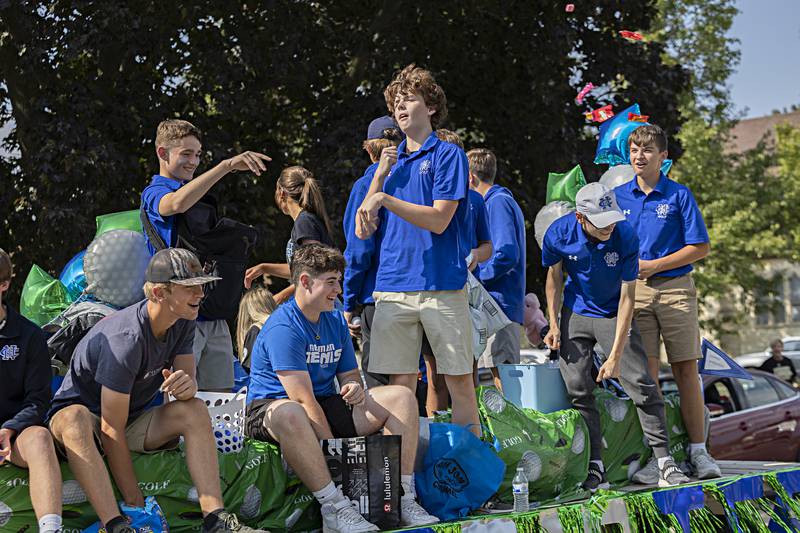 The Neman golf team rides their float Friday, Sept. 29, 2023 in the homecoming parade. The golf season is nearing its end as sectionals take place next week.
