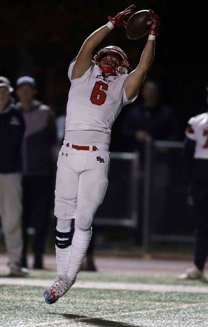 St. Rita's Owen Manning (6) reels in a touchdown pass during the second round of the IHSA Class 7A Playoffs Friday November 4, 2022 in Mount Prospect.