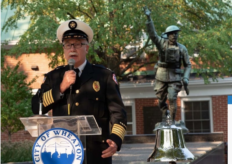 Wheaton Fire Chief William Schultz addresses the crowd at Memorial Park Saturday for the 20th anniversary of the Sept. 11 attacks. (Courtesy of the City of Wheaton)