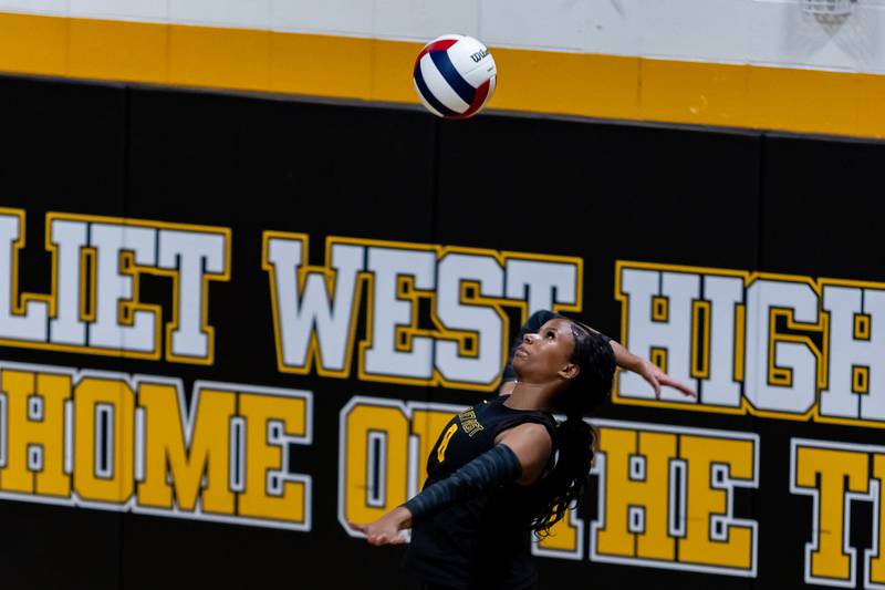 Joliet West's Eden Eyassu serves against Lincoln-Way East during a Varsity Volleyball match at Joliet West on Aug. 26, 2025.