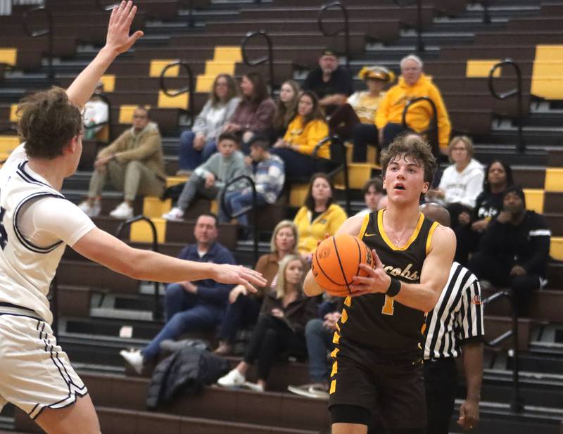 Jacobs’ Ben Jurzak takes an outside shot against Cary-Grove during Hinkle Holiday Classic varsity boys basketball tournament action on Thursday, Dec. 26, 2024 at Jacobs High School in Algonquin.