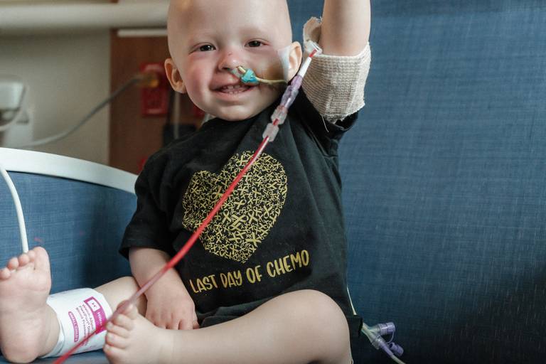 Sycamore 2-year-old Oliver Olinger holds his hand – and head – high during his last day of chemotherapy in May 2024 at Lurie Children's Hospital in Chicago.