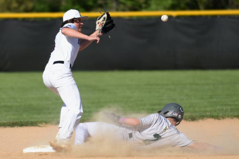 Kankakee's Parker Zubrys, left, fields a throw as Bishop McNamara's Taylor Fuerst steals second base during a game at Kankakee Friday, May 9, 2025.