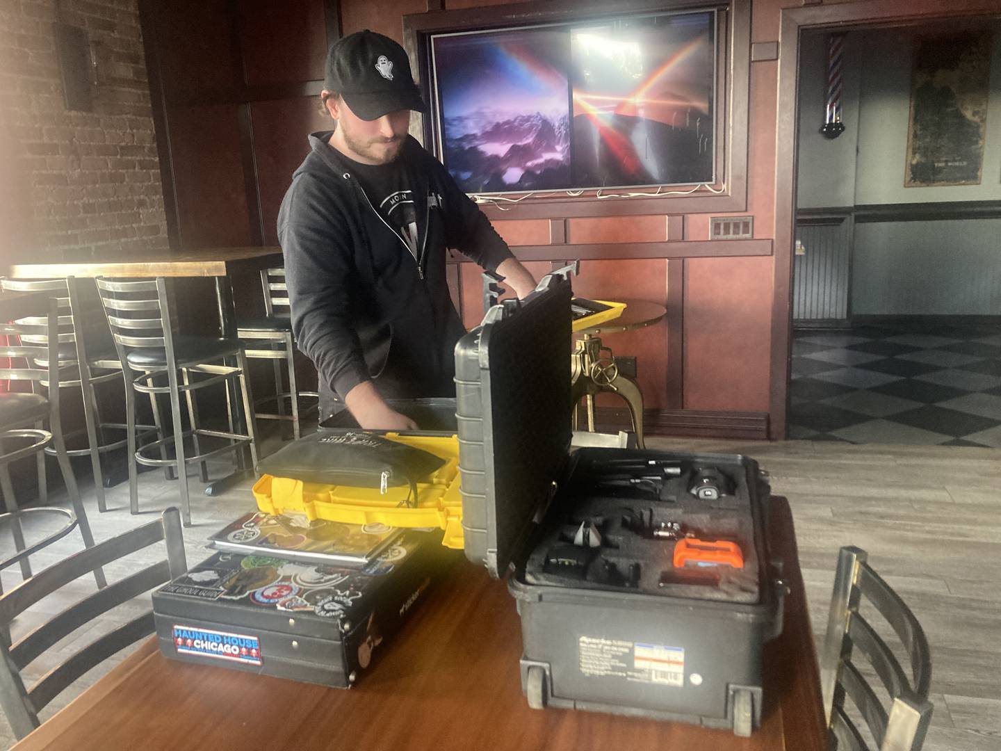 Zak Wenzel with his paranormal investigation equipment at Embers.