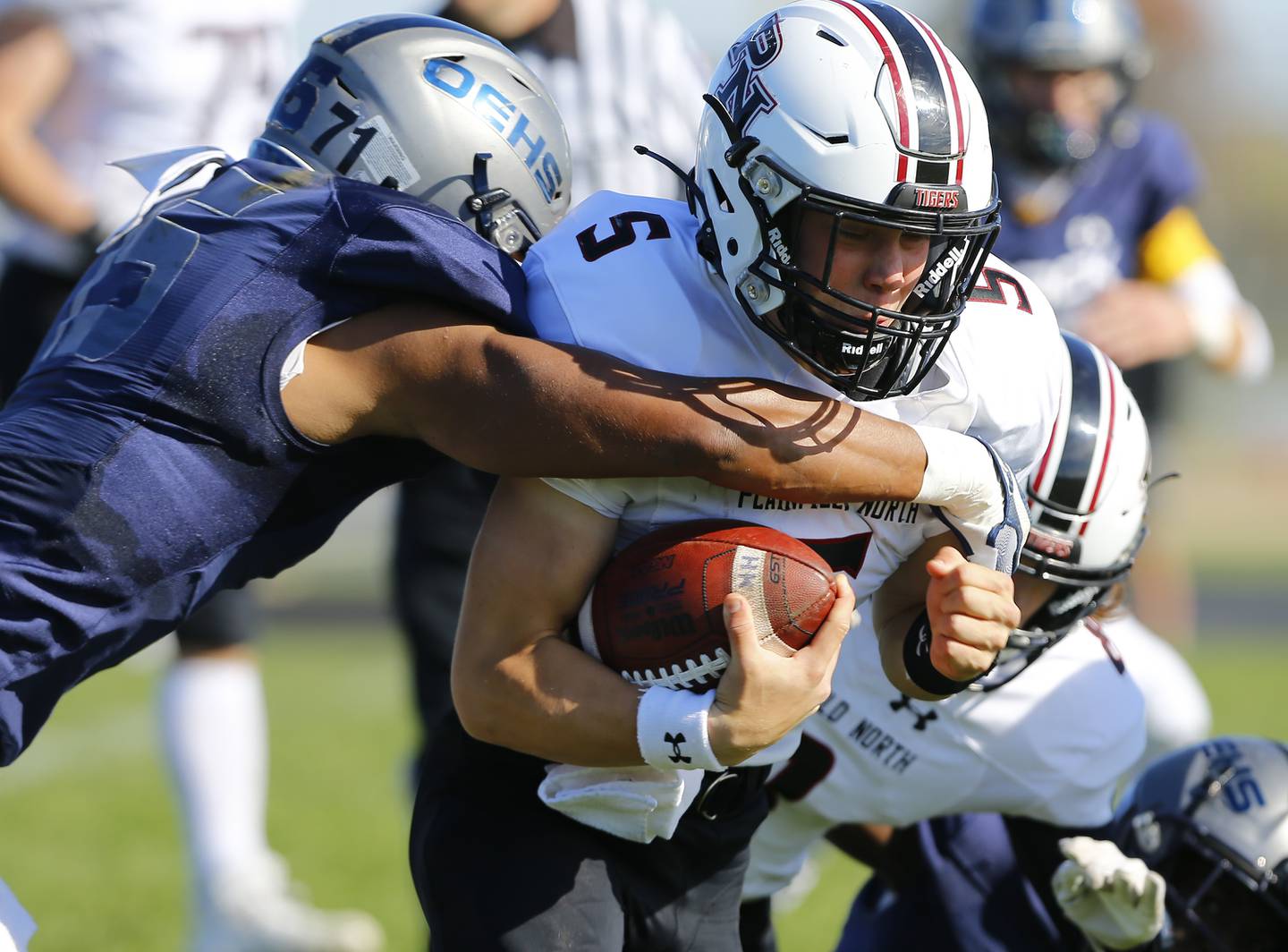 Plainfield North's Harrison Klein carries the ball during the varsity football game between Plainfield North and Oswego East on Saturday, October 23, 2021 at Oswego East high school in Oswego, IL.