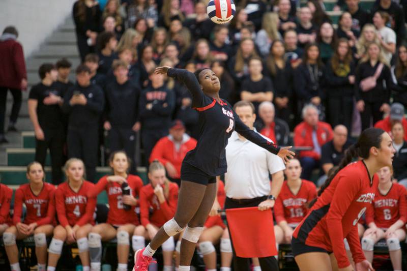 Benet's Aniya Warren returns a volley against New Trier at the Class 4A Super Sectional Final on Friday, Nov.3,2023 in Bartlett.