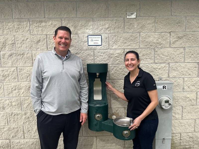 Mayor Chris Brown and Lyondell Basell Exsternal Affairs Manager Megan Borchers with a new bottle filling station.