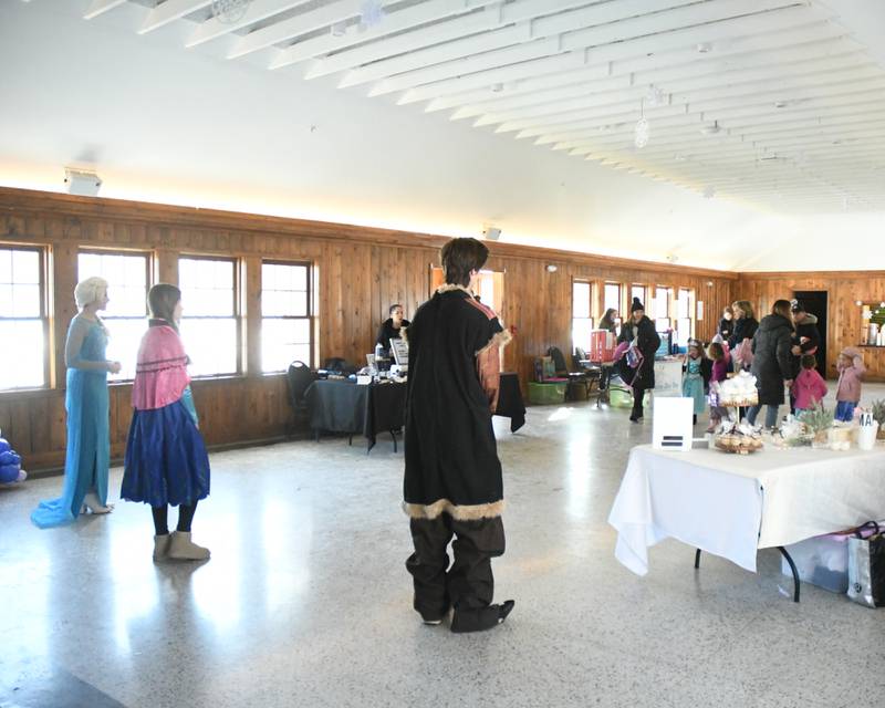 Characters from the movie Frozen wait to greet community members and take photos during the Frozen event at Lake Ellyn in Glen Ellyn on Jan. 20, 2024.