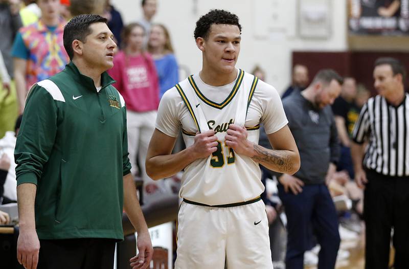 Crystal Lake South Head Coach Matt LePage talks with Cooper Buelna during the IHSA Class 3A Prairie Ridge Regional championship basketball game against Cary-Grove on Friday, Feb. 28, 2025, at Prairie Ridge High School in Crystal Lake.