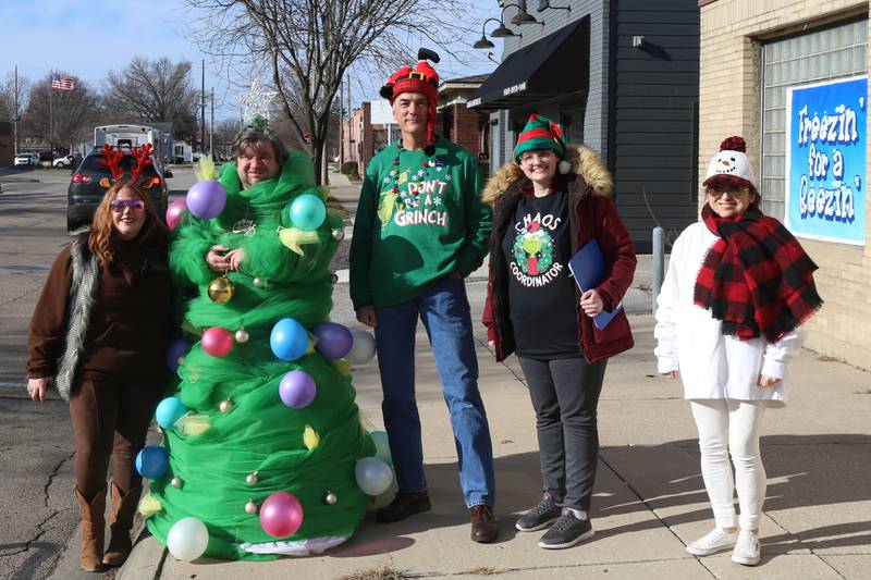(From left) Alexis Ferracuti, Nick Frig, Jeff Hettrick, Julie Petterson, and Sandy Bautista pose for a photo while helping with the 14th annual 'Freezin For a Reason' event on Friday, Dec. 2, 2022 in Ottawa.