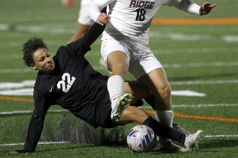McHenry's Evan Camargo tries to take the ball away from Prairie Ridge's Gabriel Porter during a Fox Valley Conference soccer match on Tuesday, Oct. 15, 2024, at McCraken Field in McHenry.