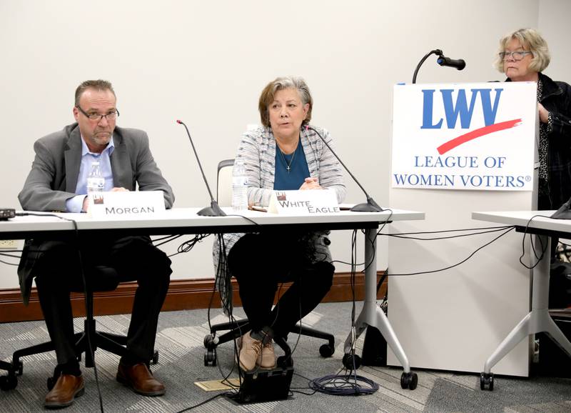 Wendy White Eagle (right), candidate for Campton Hills trustee, answers a question as candidate Timothy Morgan and moderator Patti Lackman look on during a candidates’ forum hosted by the League of Women Voters at the Campton Hills Village Hall on Thursday, March 2, 2023.