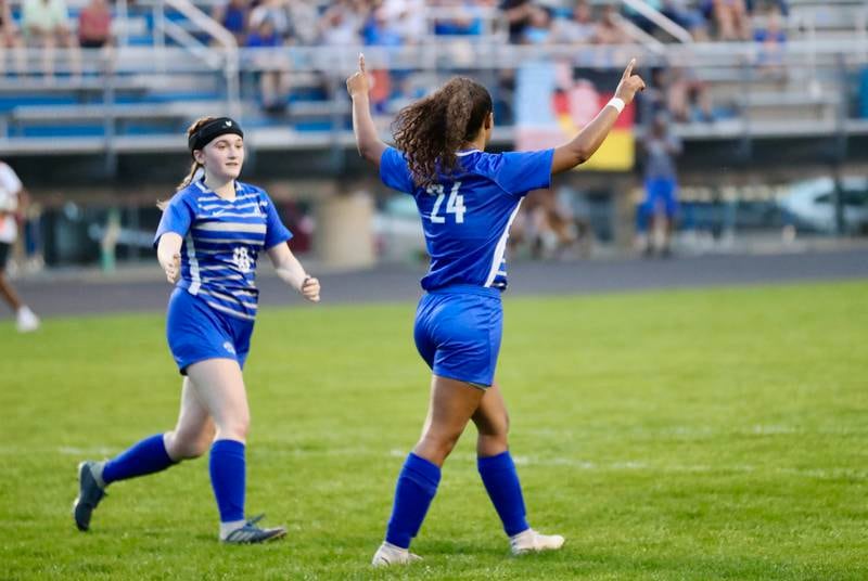 Princeton junior Mariah Hobson (24) celebrates with teammate Jayden Sims after scoring a goal in the Tigresses' 6-2 win over Hinckley-Big Rock in a Class 1A Princeton Regional semifinal Tuesday, May 10 in Princeton.