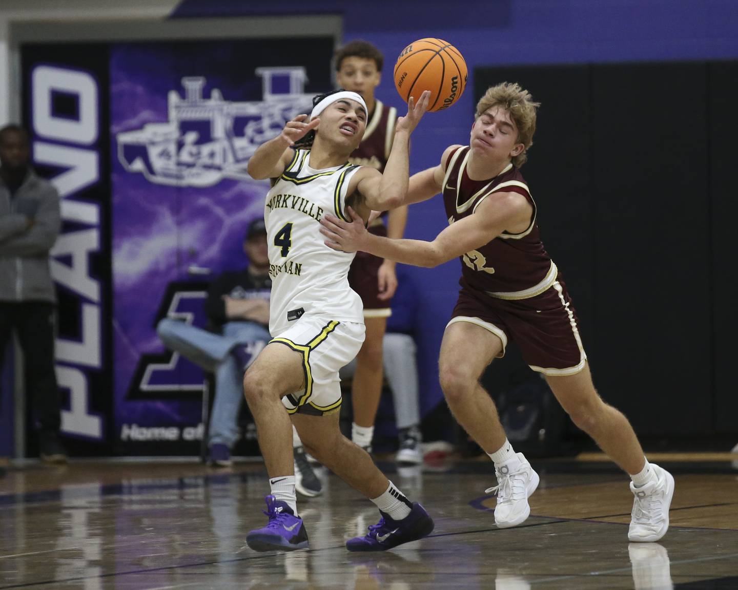 Yorkville Christian's Tray Alford (4) fights for a loose ball during their Plano Christmas Classic basketball game between Morris at Yorkville Christian Friday, Dec 26, 2025 in Plano.