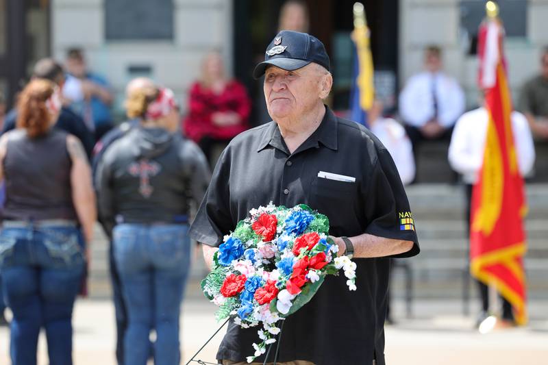 Jim Wasser, a U.S. Navy Vietnam veteran of St. Anne, helps place the wreaths on Monday, May 26, 2025, during the Kankakee County Veterans' Council annual Memorial Day Ceremony at the Kankakee County Courthouse.