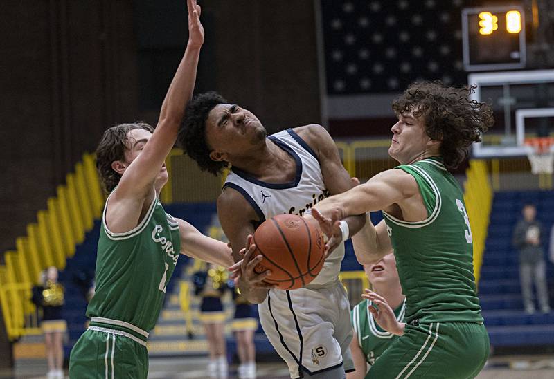 Sterling’s Kaedon Phillips gets fouled by Geneseo’s Joshua Anderson Thursday, Jan. 11, 2024 at Sterling High School.