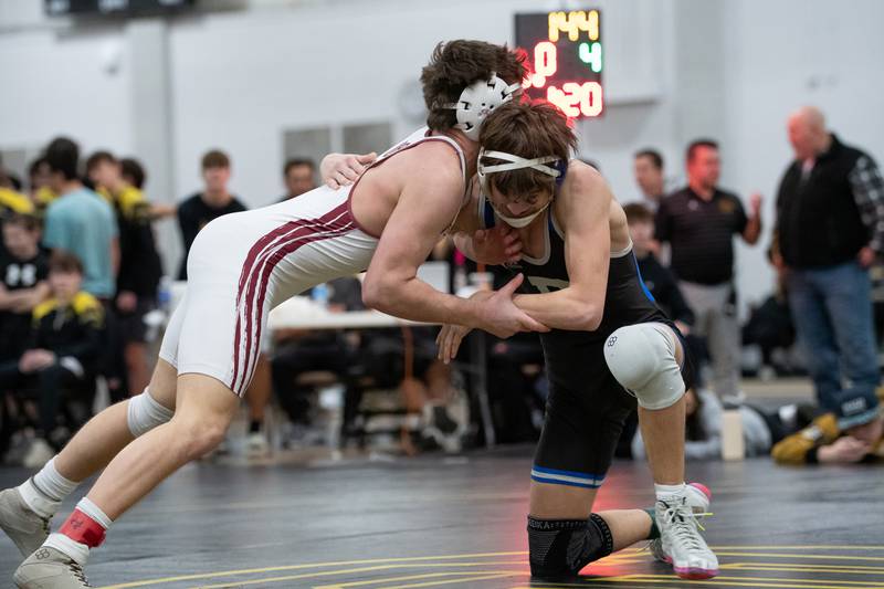 Wheaton Academy's Lincoln Hoger, left, and Petersburg Porta's Zach Bryant wrestle in the 144-pound championship match during the Reed-Custer Comet Classic Wrestling Invite on Saturday, Jan 17.
