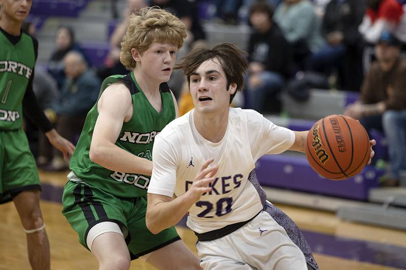 Dixon’s Mason Weigle drives the baseline against North Boone Tuesday, Jan. 10, 2023.