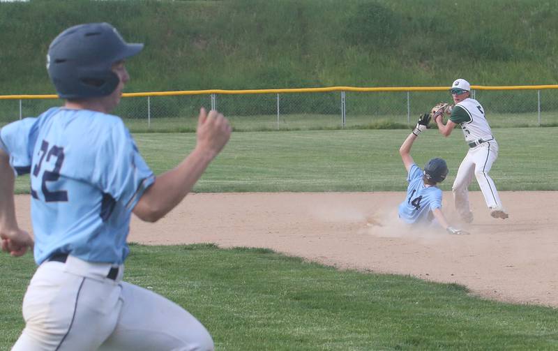Bureau Valley's Tyce Barkman (left) beats out the throw to first by St. Bede's Sturart McGunnigal as his teammate Drake Taylor gets thrown out at second base on an attempted double play on Wednesday, May 14, 2025 at St. Bede Academy.