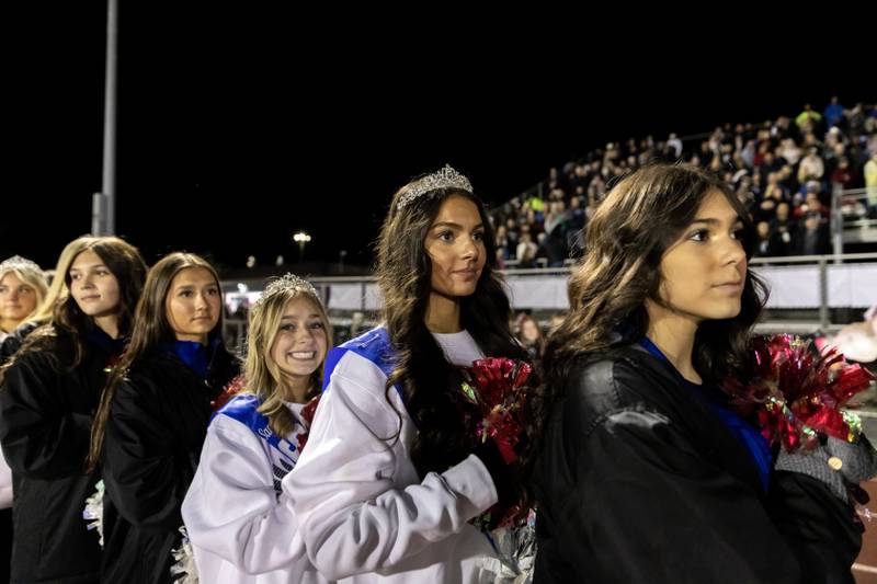 Lincoln-Way East’s cheer team lines up for the pre-game ceremony prior to a varsity football game against Sandburg at Lincoln-Way East on Oct. 23, 2025.