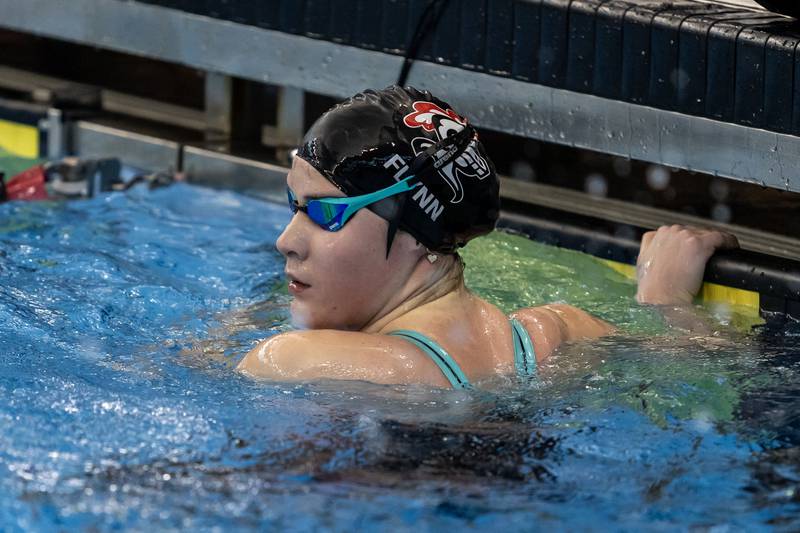 Lincoln-Way Central’s Ell Flynn looks up at the board after competing in the 200 Yard Medley Relay during the IHSA Girls State Swimming Preliminaries at FMC Natatorium in Westmont on Nov. 14, 2025.
