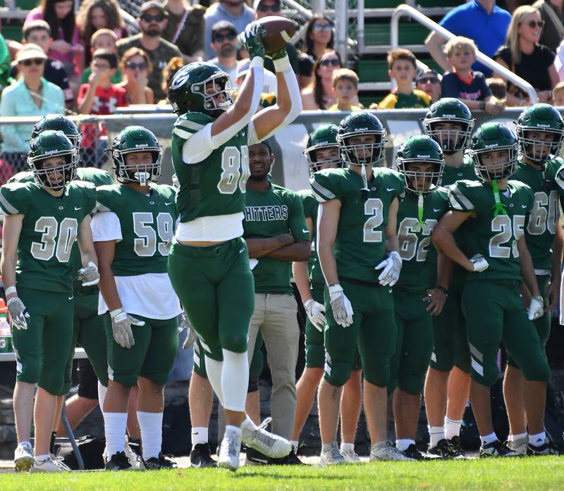 Glenbard West’s Brady Johnson (80) makes a catch near the sideline for a first down during a game against Lyons Township on September 27, 2025 at Glenbard West High School in Glen Ellyn.