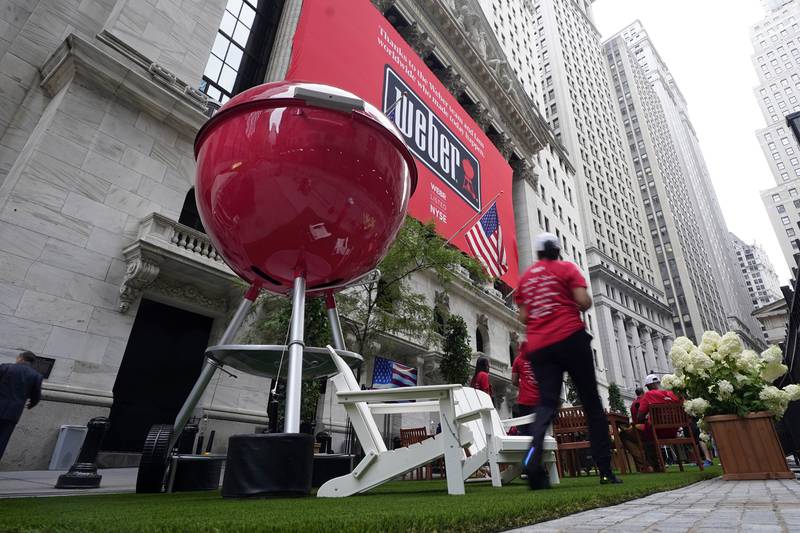 FILE - A giant Weber Inc. grill is displayed outside the New York Stock Exchange prior to the company's IPO, Aug. 5, 2021. Weber is being taken private in a deal valued at about $3.7 billion. Investment funds managed by BDT Capital Partners LLC will buy all of the outstanding shares of Weber Inc. that they don’t already own for $8.05 per share. Weber’s board has approved the transaction, which is expected to close in the first half of next year.