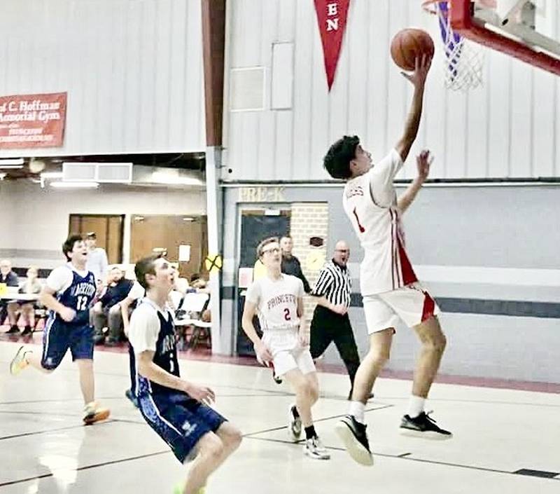 Princeton Christian Academy's Santi Slevin takes in a layup in the first half of Monday's high school game at Howard Hoffman Memorial Gym in Princeton. Slevin scored 16 points to lead the Eagles to a 62-40 win over Dunlap Excel Aademy.