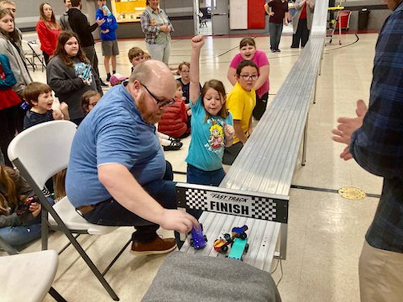 Matt. Eggers checks the finish line during the AWANA Pinewood Derby Night at Princeton Bible Church.
